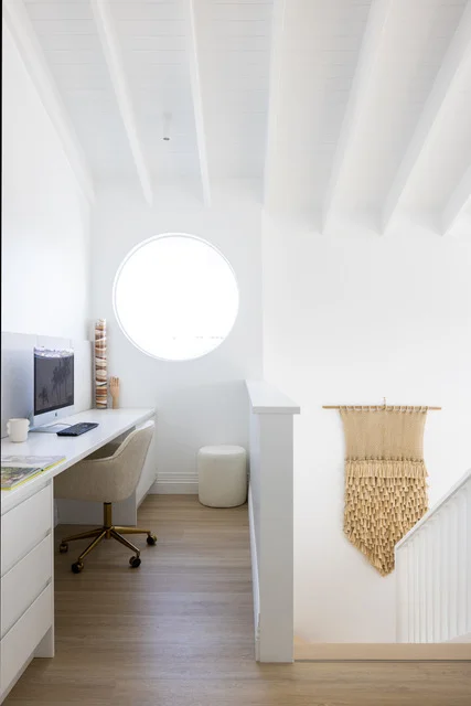 Coastal home office with light oak hybrid flooring