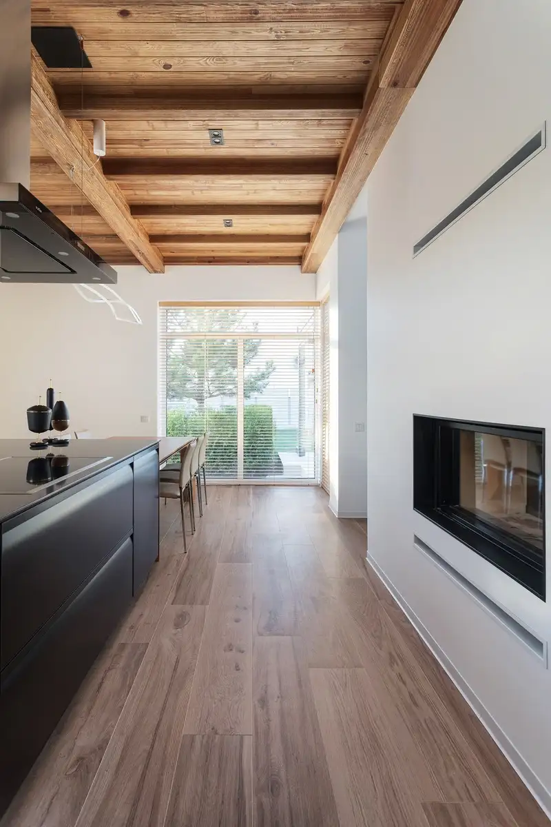 Restored hardwood flooring in modern Inner West kitchen with exposed timber beams